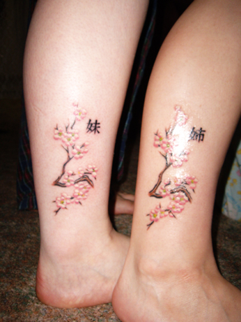 sisters tattoo. cherry blossom tattoo sisters