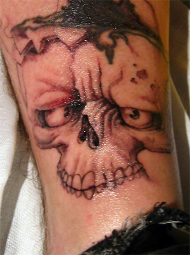 cross tattoos for men One crosseyed skull