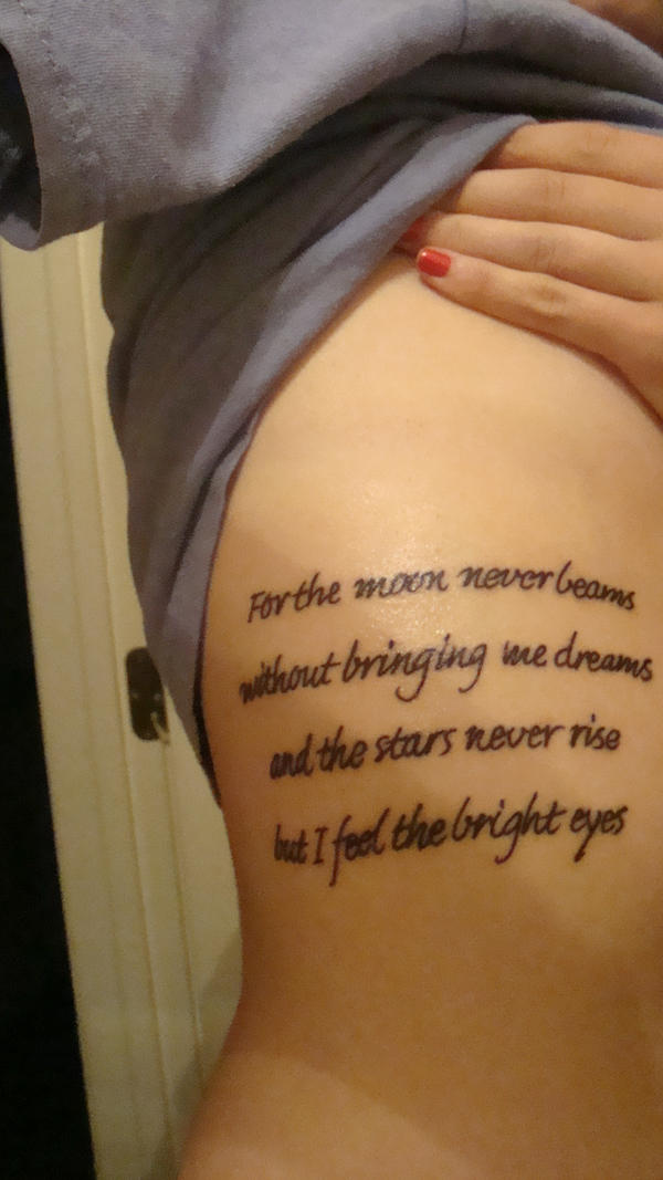 Quote tattoos on rib cage is the perfect combination of using words in the