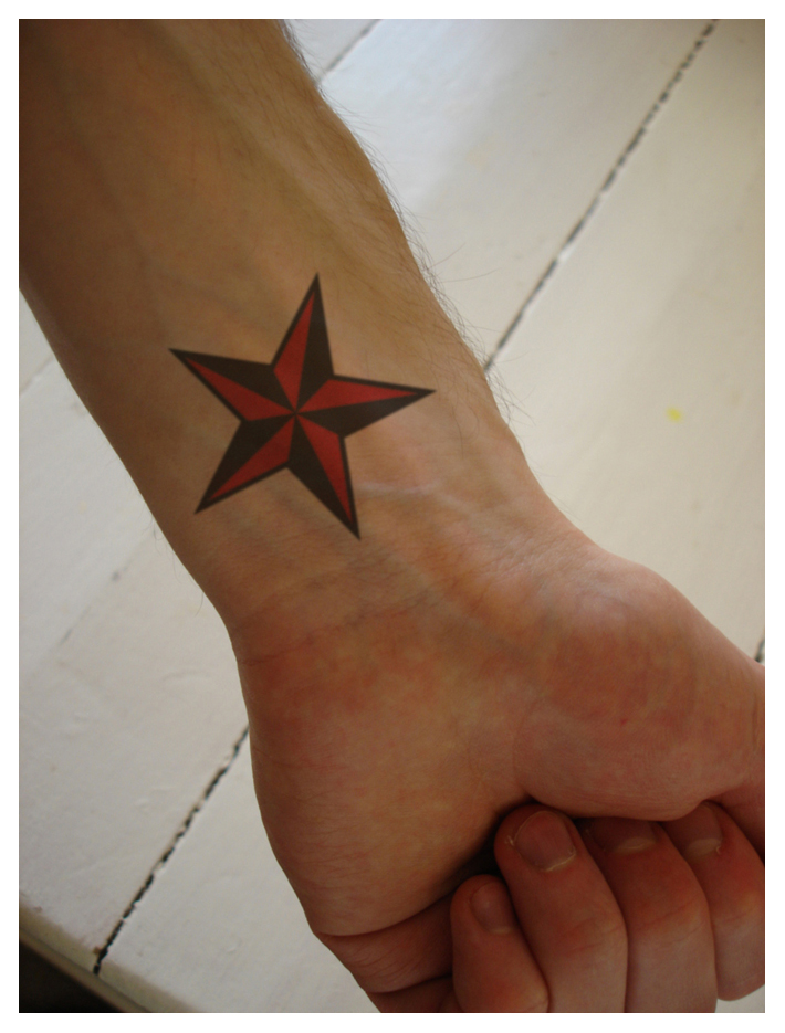 Superimposed tattoo wrist star