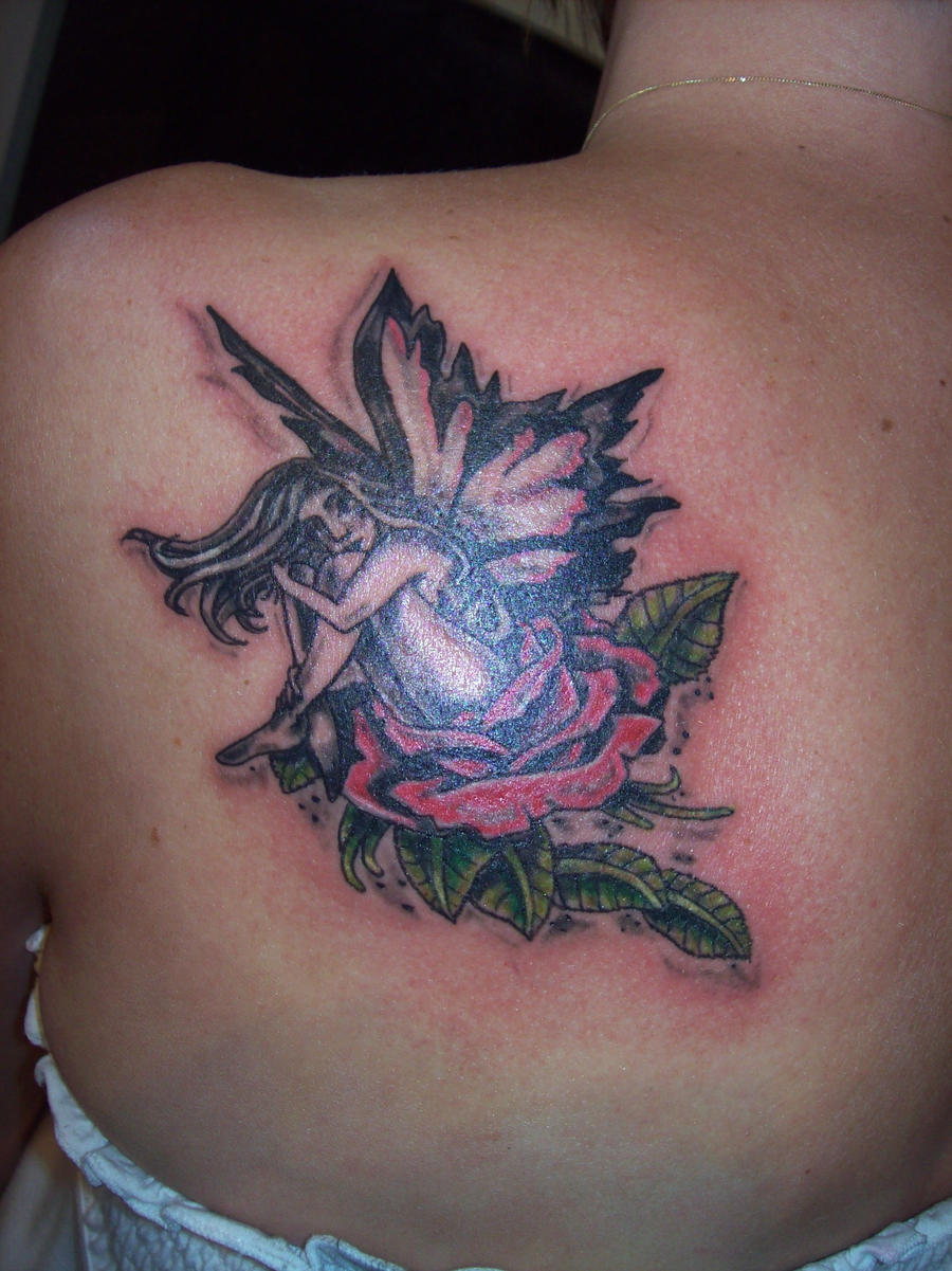 fairy sitting on a rose tattoo
