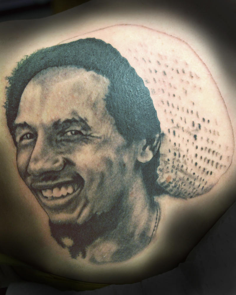 Bob Marley portrait tattoo by